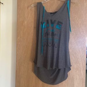 Tank top says “Live for the Run”
